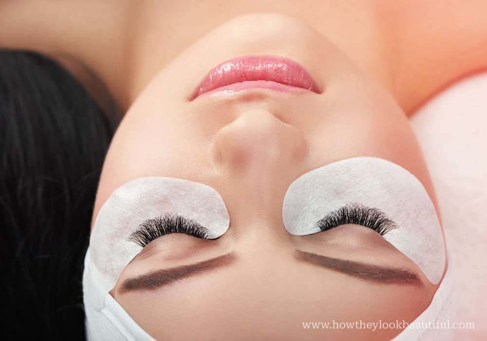 Woman getting eyelash extensions attached