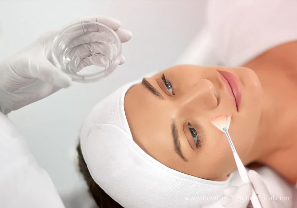 Chemical peel getting applied on woman's face